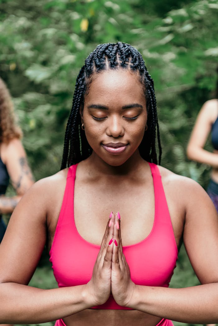 gallery-04 Young woman practicing meditation outdoors, promoting wellness and relaxation.